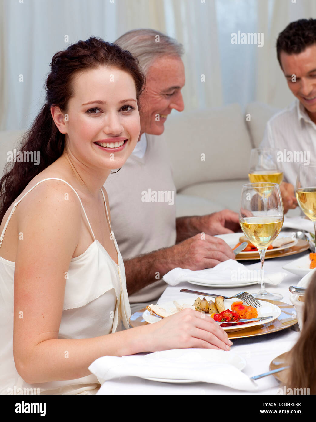 Woman in Christmas dinner with her family Stock Photo Alamy