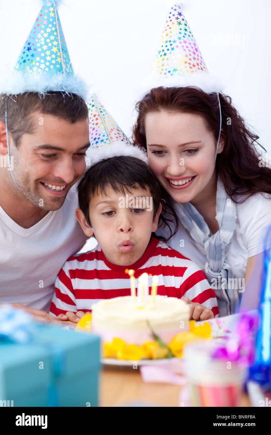 Little boy blowing out candles on his birthday's day Stock Photo Alamy