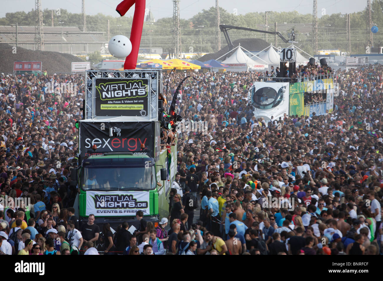 Loveparade in Duisburg, Germany. Biggest techno music festival in the world. Hundred thousand of people come to party. Stock Photo