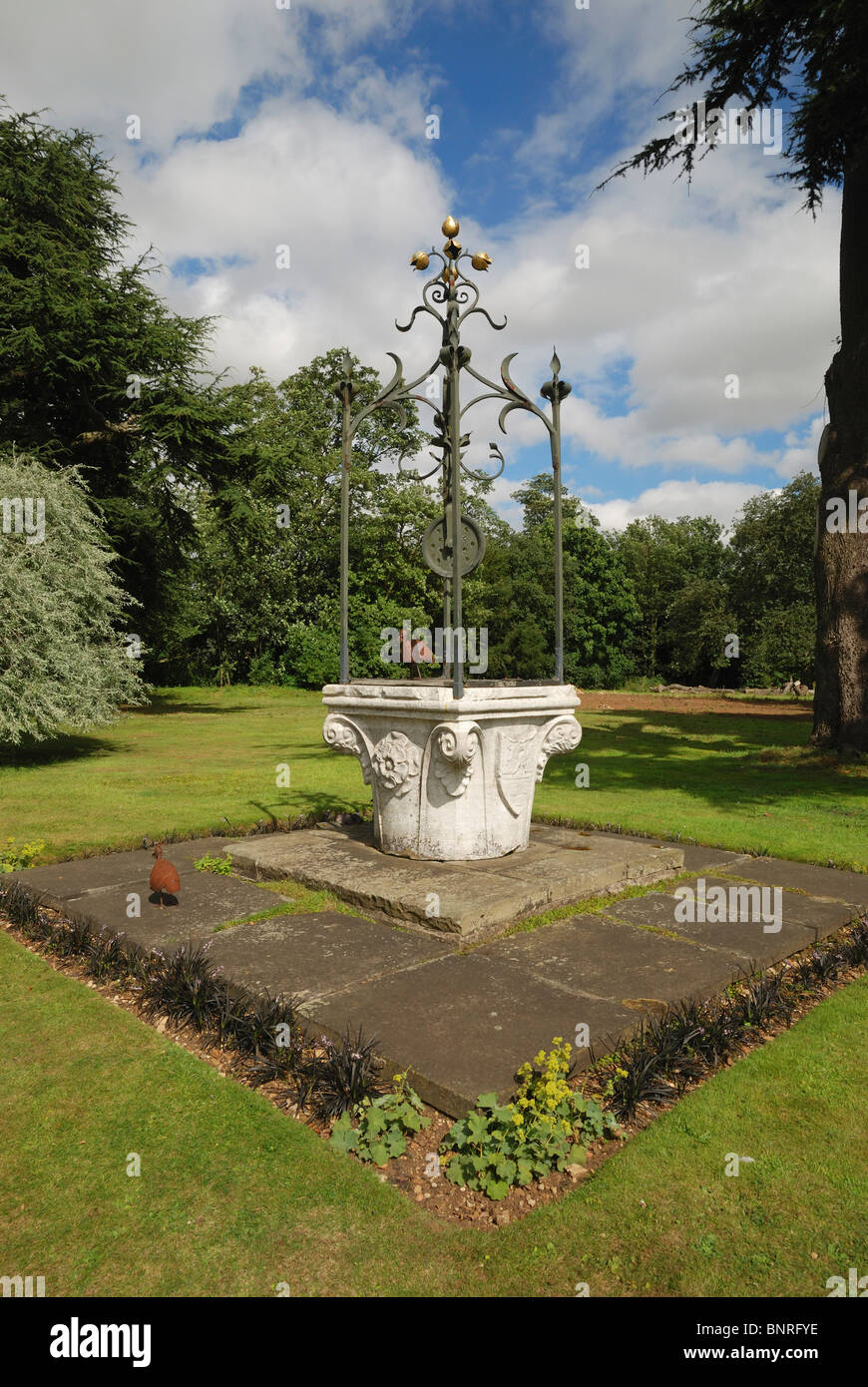An Italian well-head used as an ornament in the grounds of Fulbeck Hall, Lincolnshire, England. Stock Photo