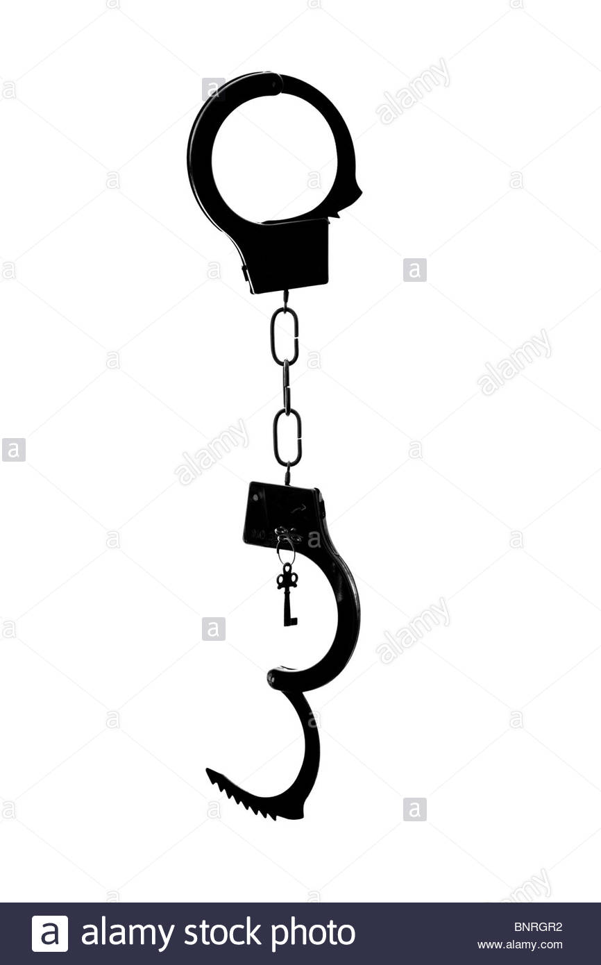 Silhouetted handcuffs Stock Photo