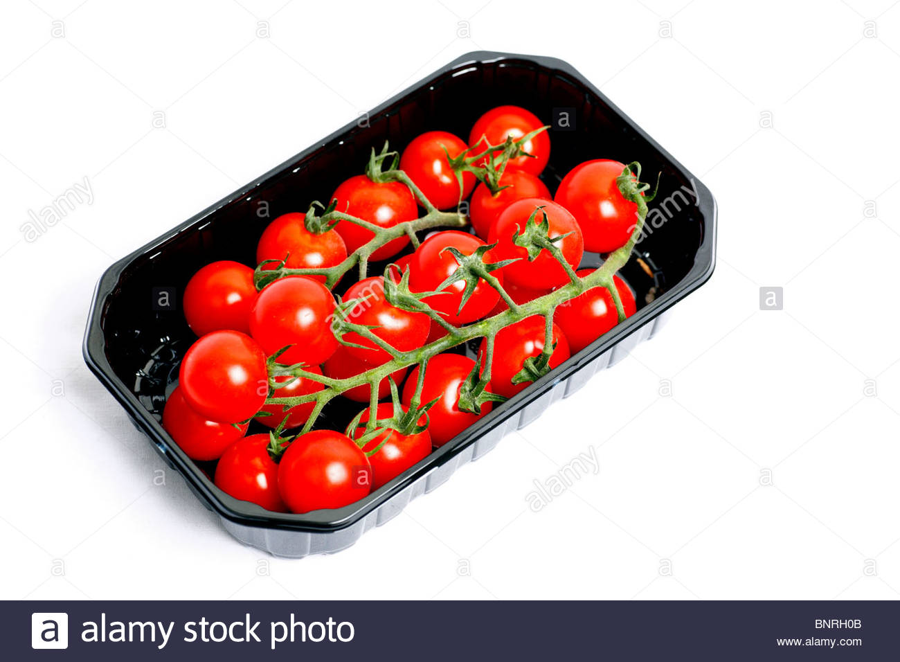 Cherry tomatoes in tray Stock Photo