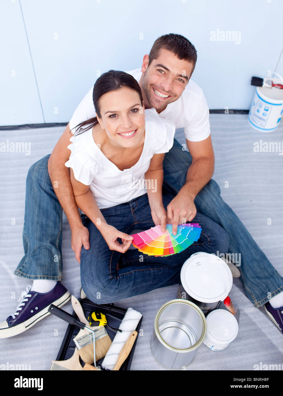 High angle of couple chosing colours to paint new house Stock Photo Alamy