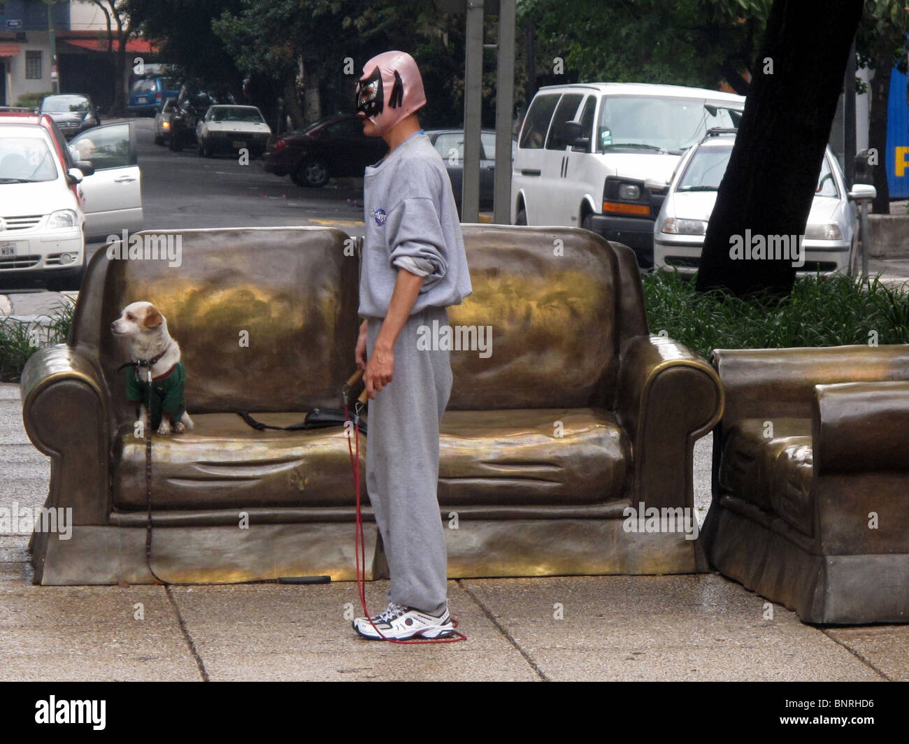 A man jumps rope wearing a Mexican Lucha Libre wrestling mask along the Paseo de la Reforma avenue, Mexico City. Stock Photo