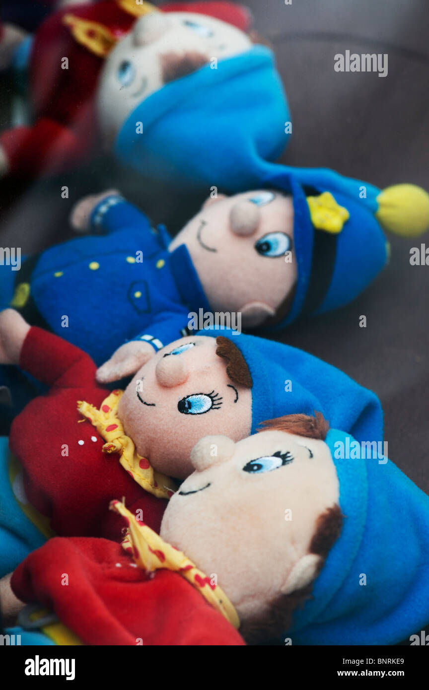 Noddy and Mr Plod soft toys in the back of a car Stock Photo