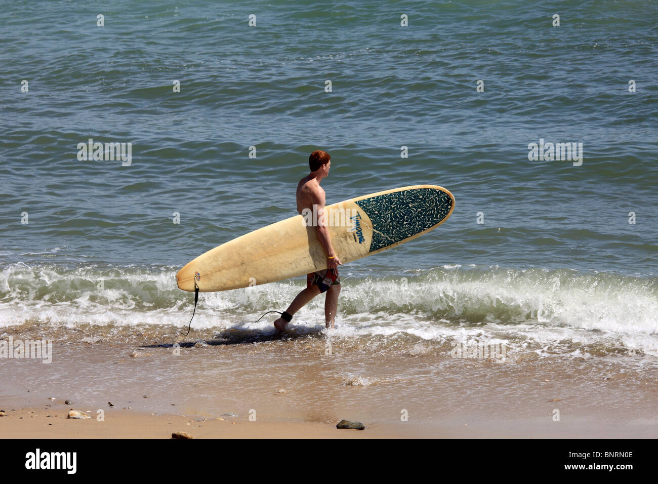 Surfer On Beach Ditch Plains Montauk Long Island Ny Stock