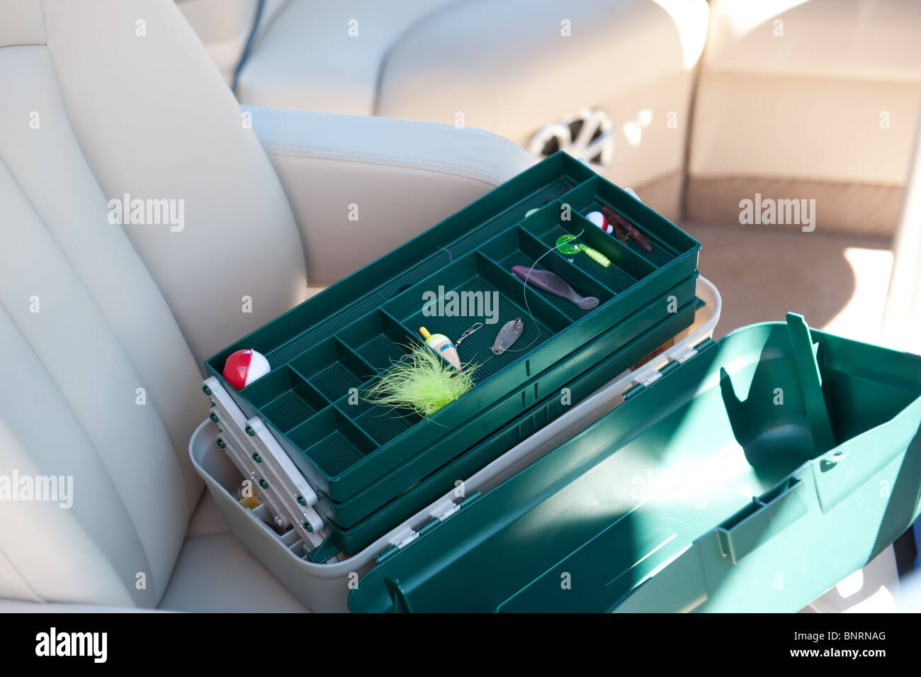 Fishing tackle box with bobber and lures Stock Photo Alamy