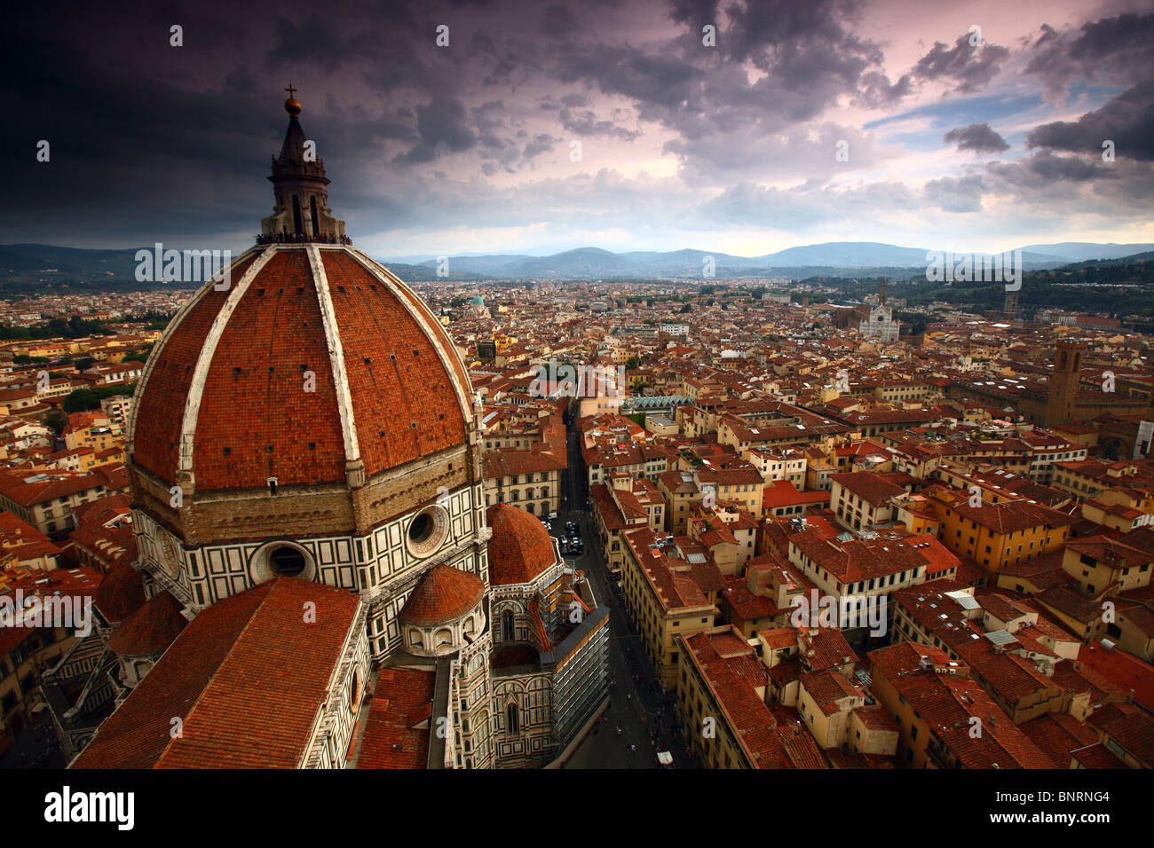 The dome of the Florence Duomo, as seen from the Campanile, under approaching storm clouds, Italy. Stock Photo