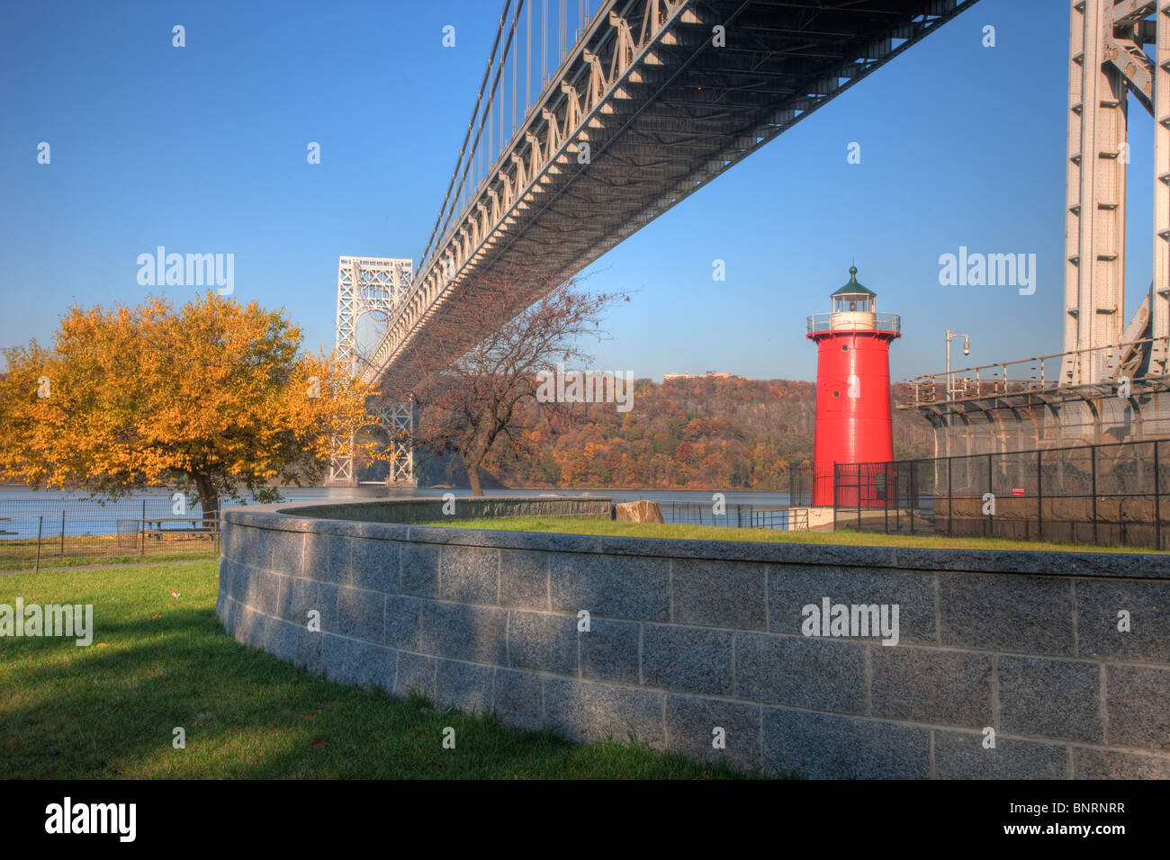 Jeffrey's Hook Lighthouse on the Hudson River, under the George Washington Bridge, as seen from Fort Washington Park Stock Photo
