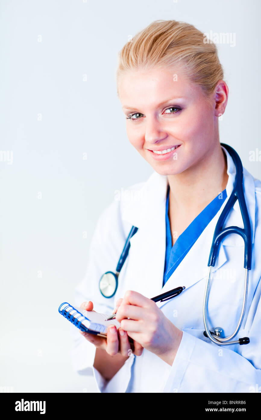 Female doctor writing a perscription Stock Photo - Alamy