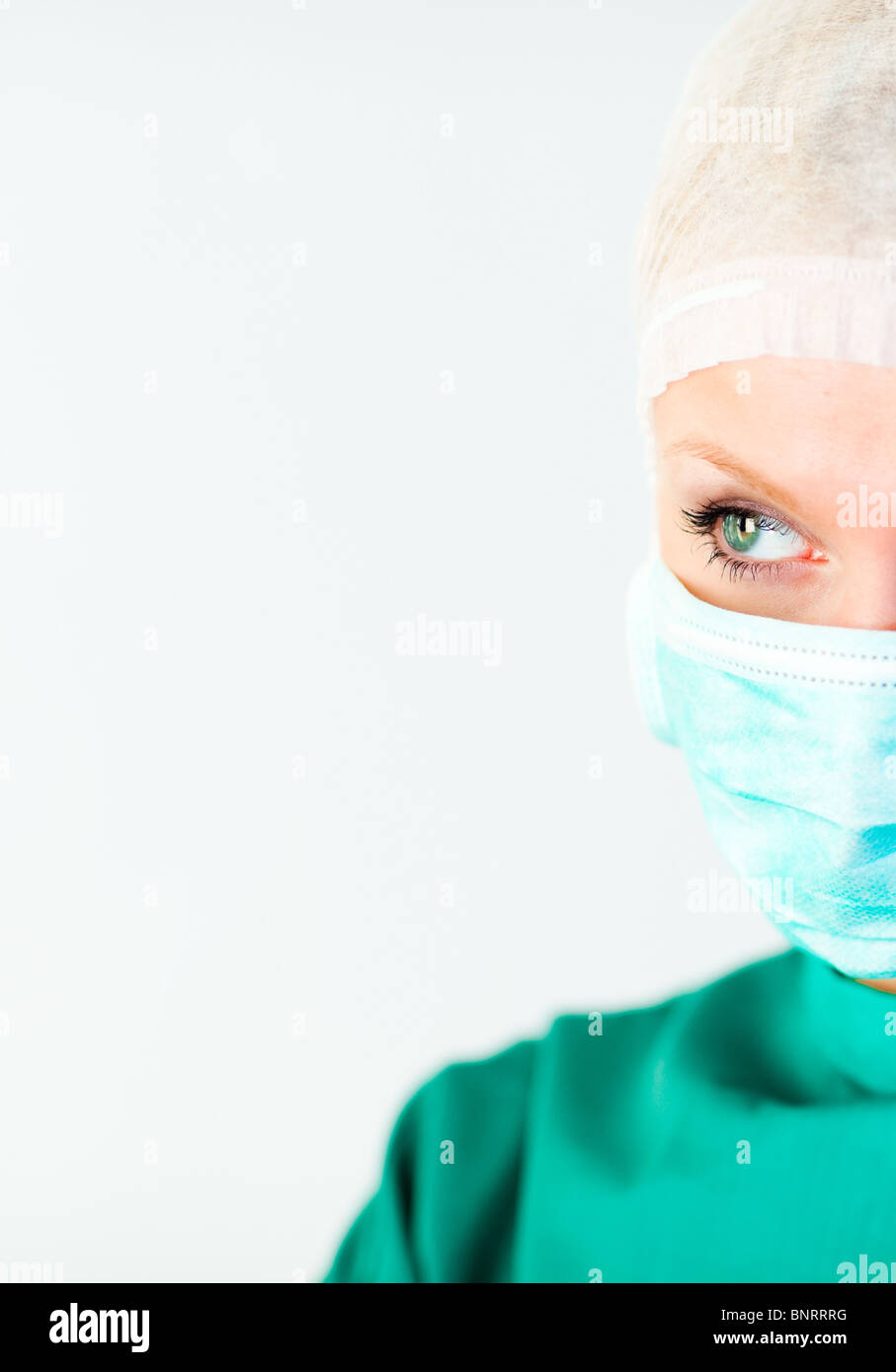 Bright female surgeon with a mask Stock Photo - Alamy
