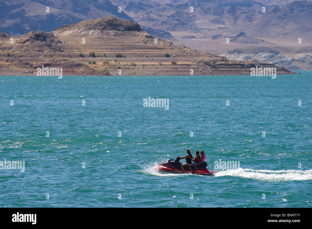 USA Nevada - Lake Mead recreation. Three girls on a jet ski Stock Photo