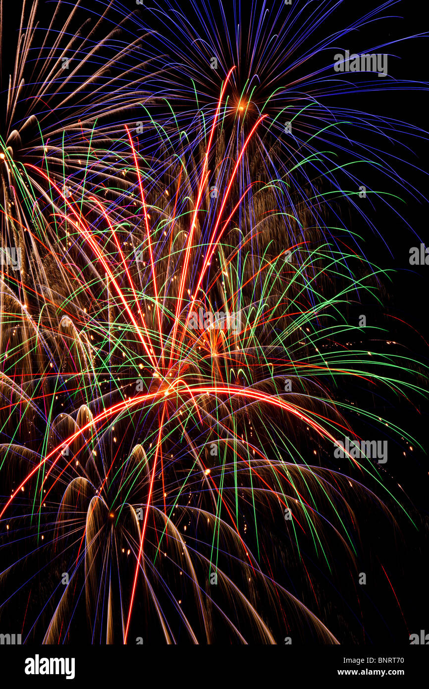 Fireworks exploding in night sky, pyrotechnics Stock Photo Alamy