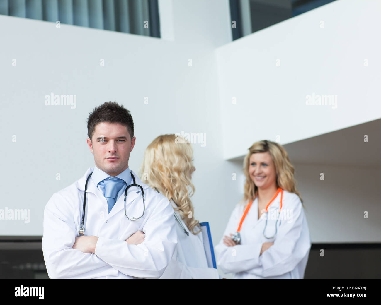 Triplicate Doctor Three doctors in a hospital Stock Photo - Alamy
