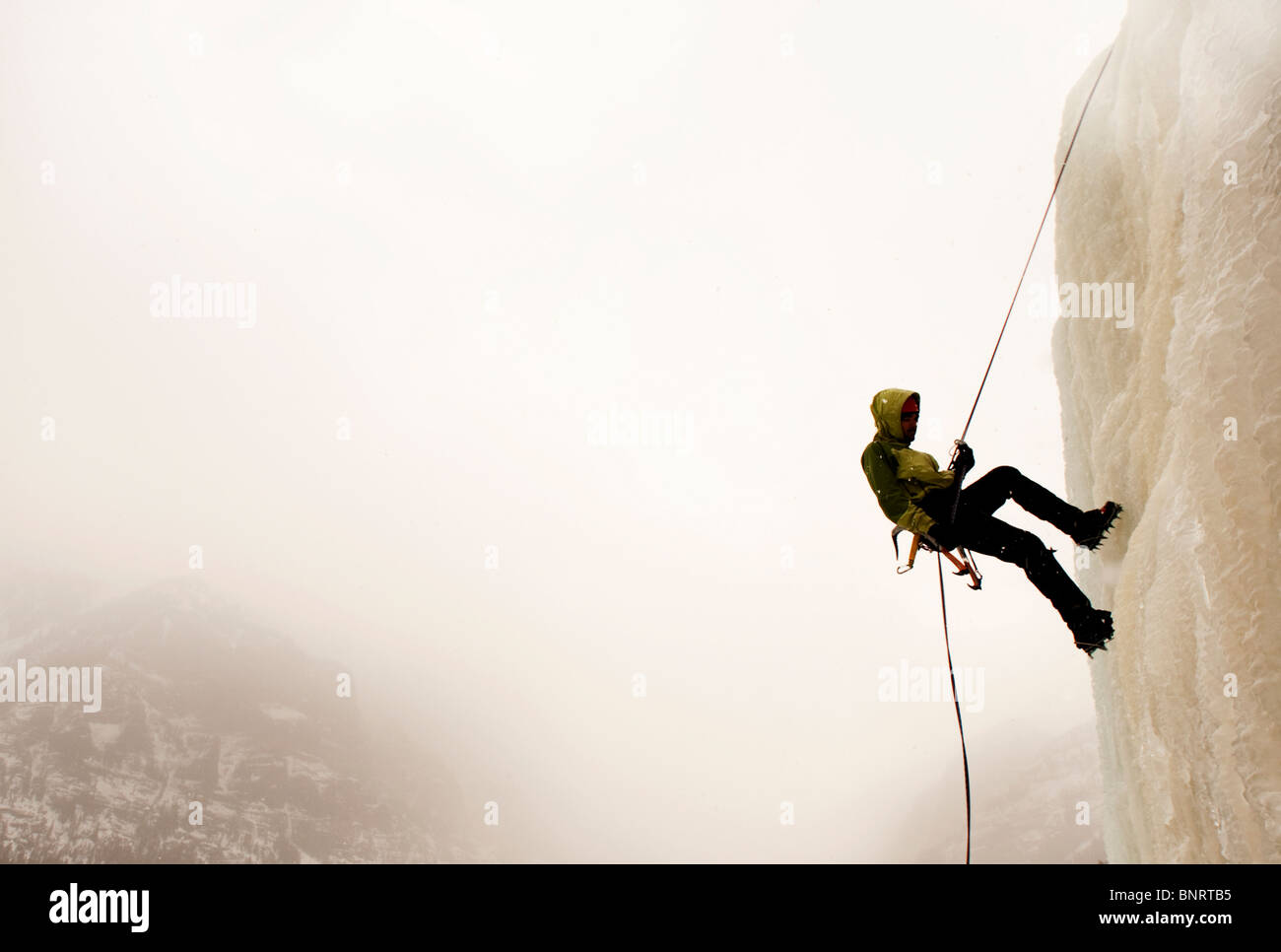 A man ice climbing. Stock Photo