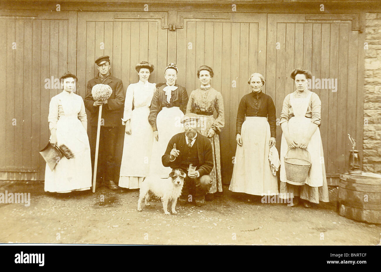 Photographic postcard of domestic household staff Stock Photo