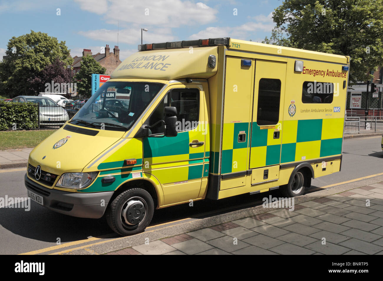 A London Ambulance Service vehicle parked on double yellow lines at the ...