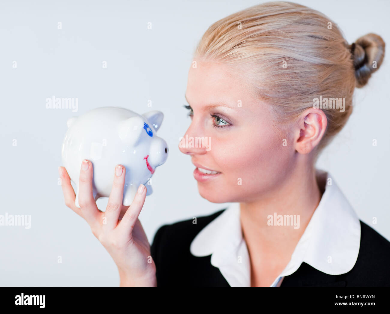 Portrait of a happy Business woman holding a piggy Bank Stock Photo - Alamy