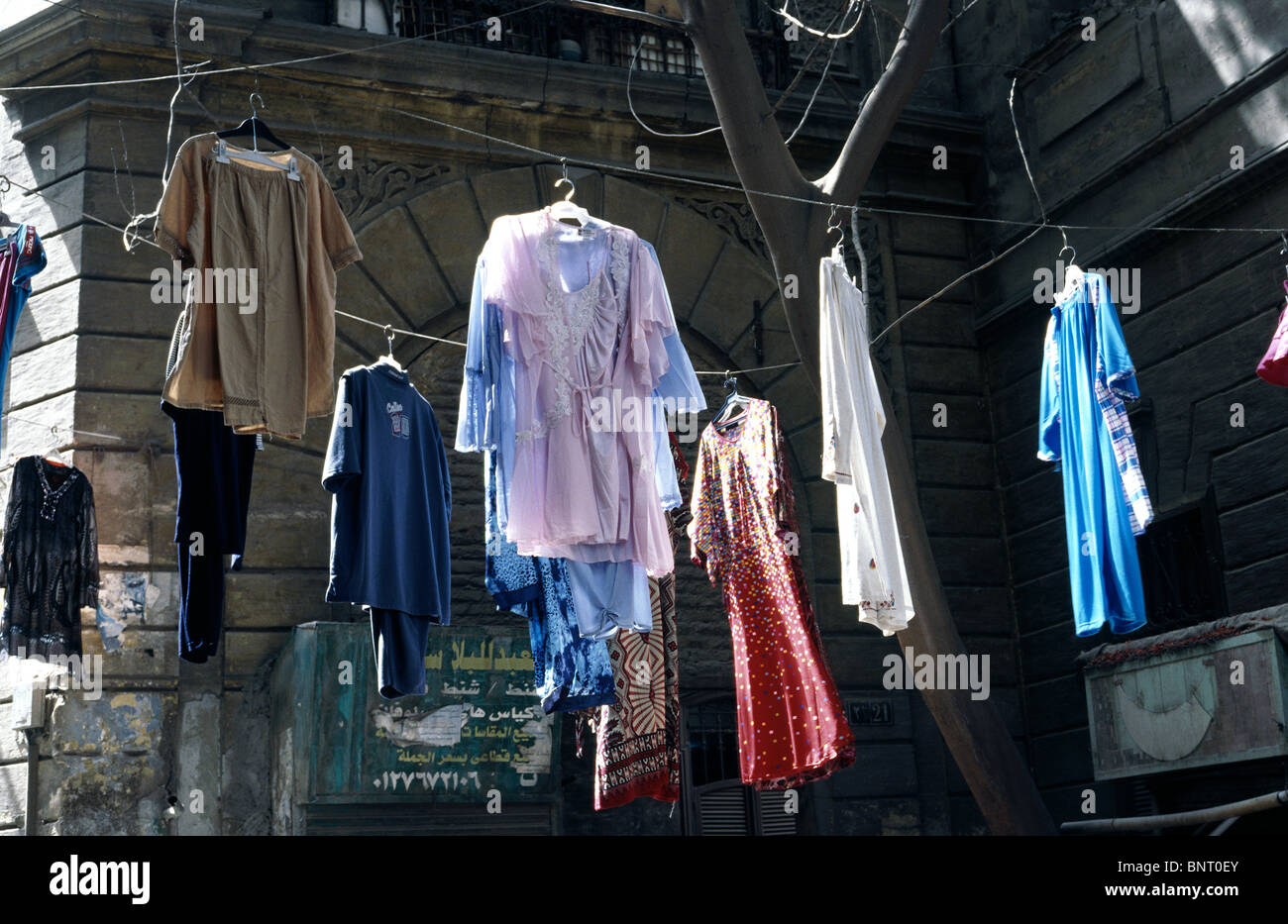 Dresses displayed outside a clothes shop at a bazaar in Islamic Cairo. Stock Photo