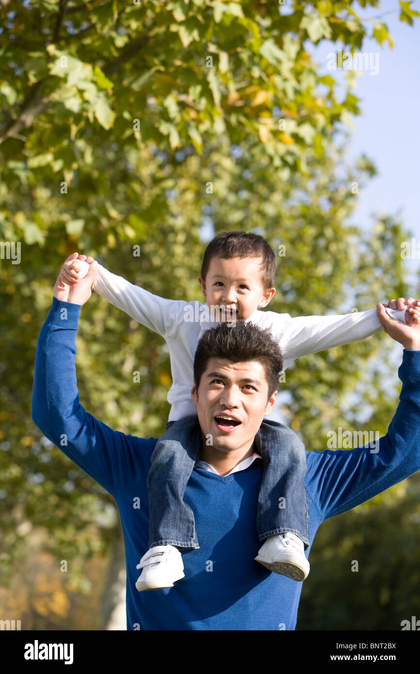 Portrait of father and son in the park Stock Photo - Alamy