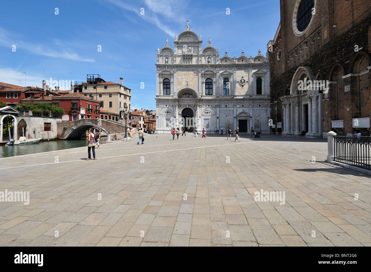 Venice. Italy. Campo Santi Giovanni e Paolo, Scuola Grande di San Marco (Left) the church of Santi Giovanni e Paolo (Right). Stock Photo