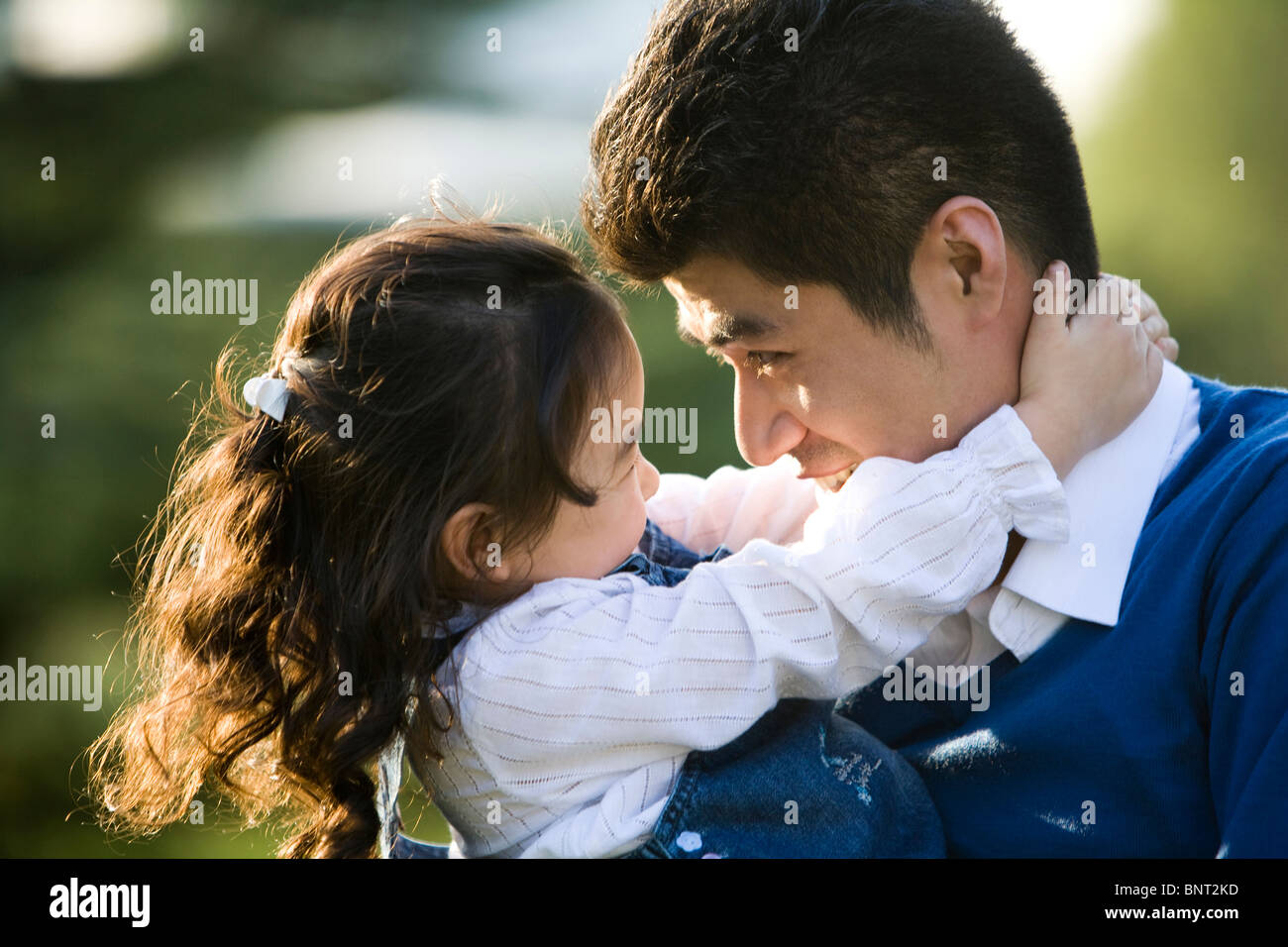 Portrait of father and daughter at the park Stock Photo - Alamy