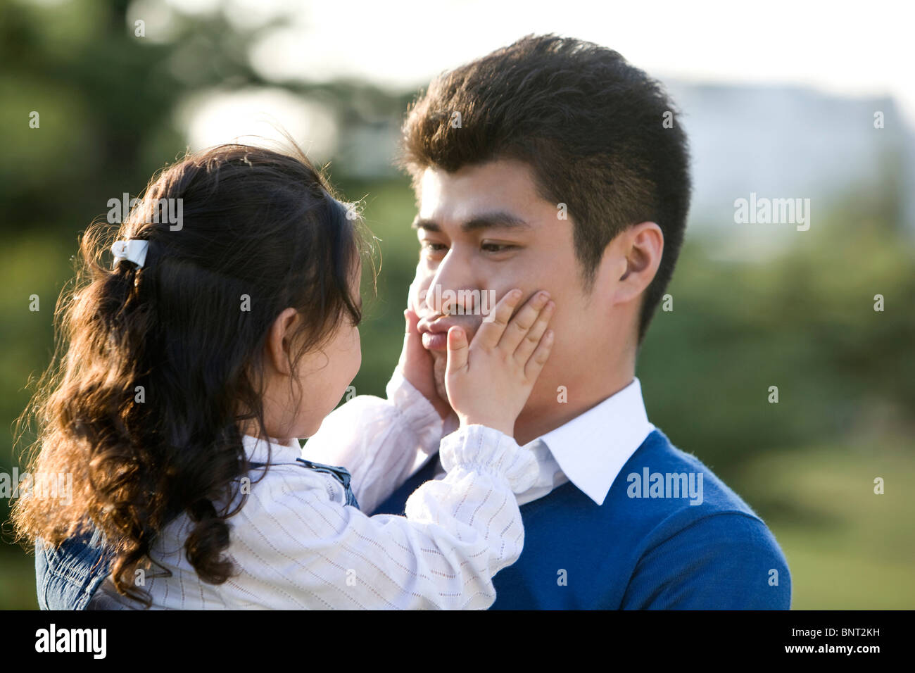 Portrait of father and daughter at the park Stock Photo - Alamy
