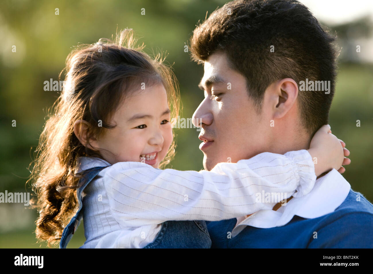 Portrait of father and daughter at the park Stock Photo - Alamy