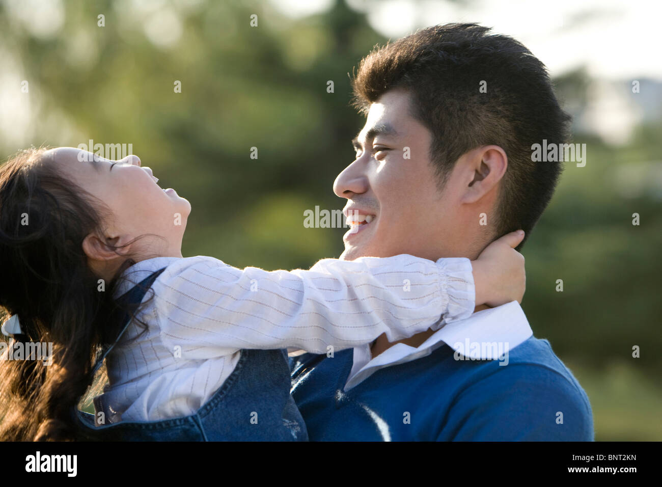 Portrait of father and daughter at the park Stock Photo - Alamy