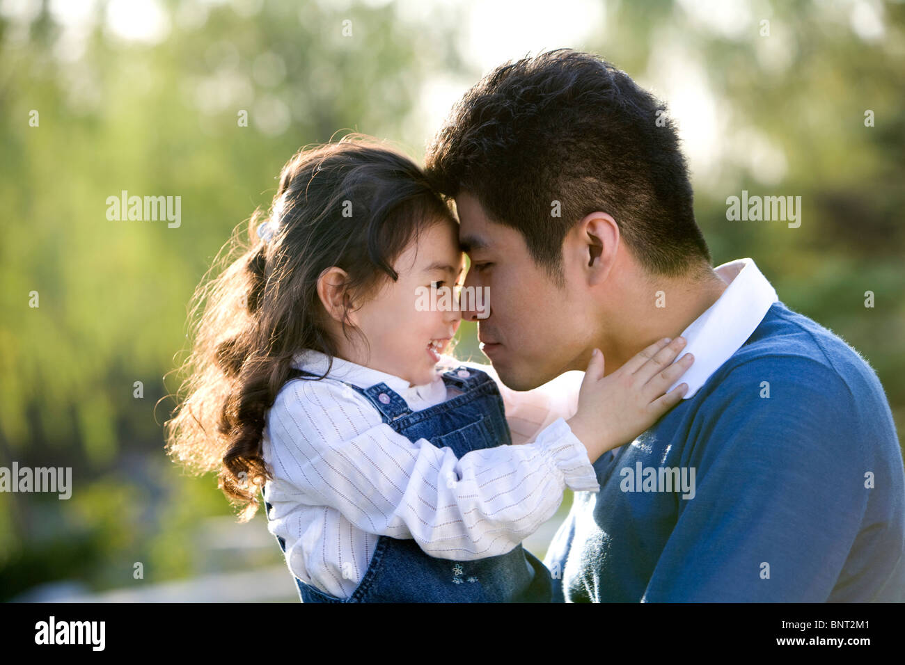 Portrait of father and daughter at the park Stock Photo - Alamy