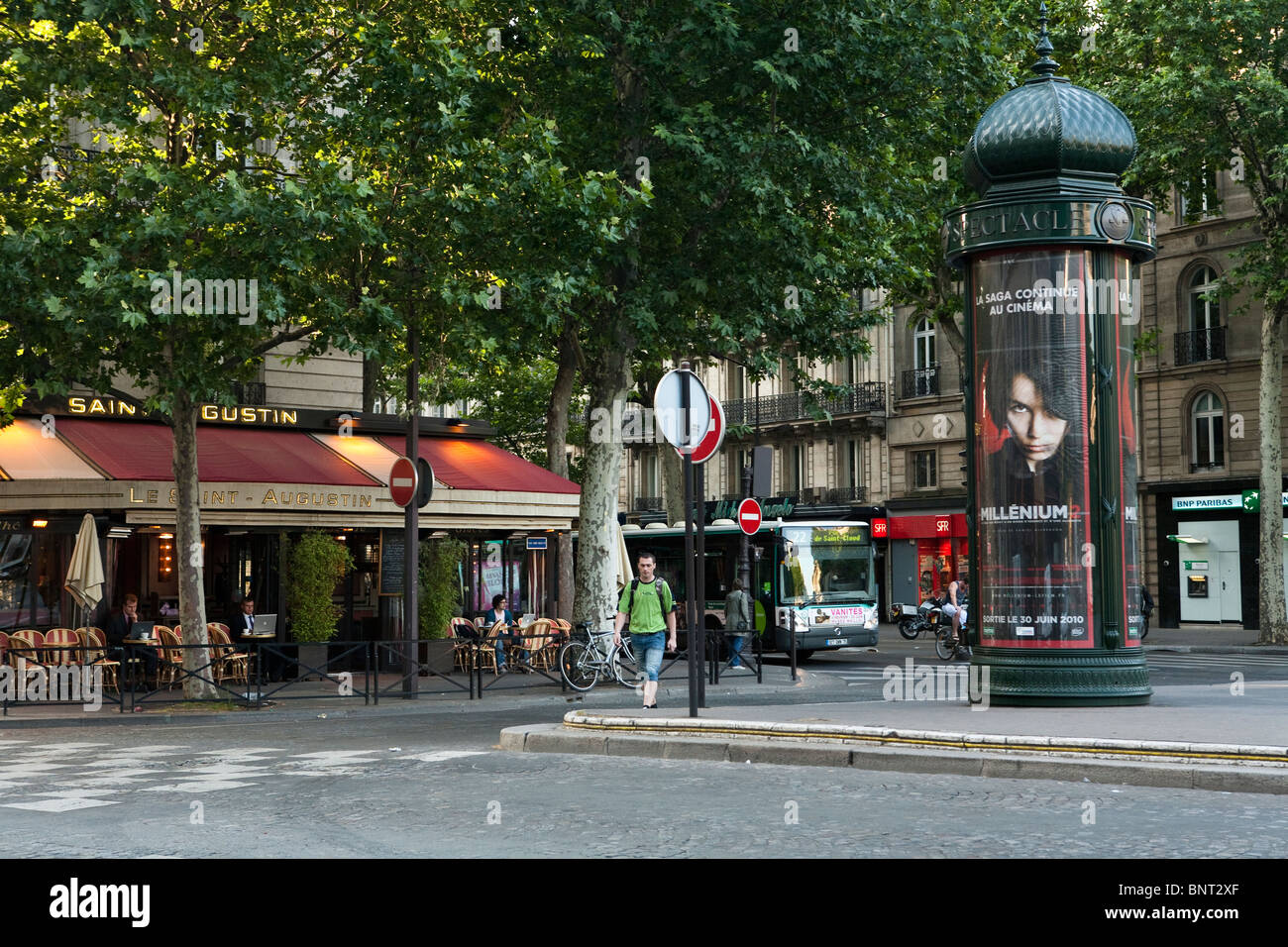 Paris outdoor scene of place st austin with cafe and advertising column in the morning light Stock Photo