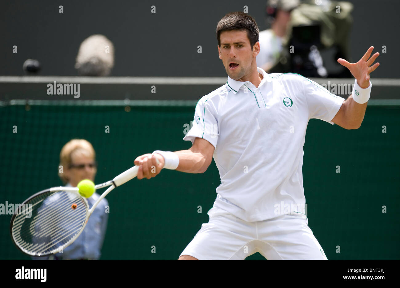 Novak Djokovic (SRB) in action during the Wimbledon Tennis ...