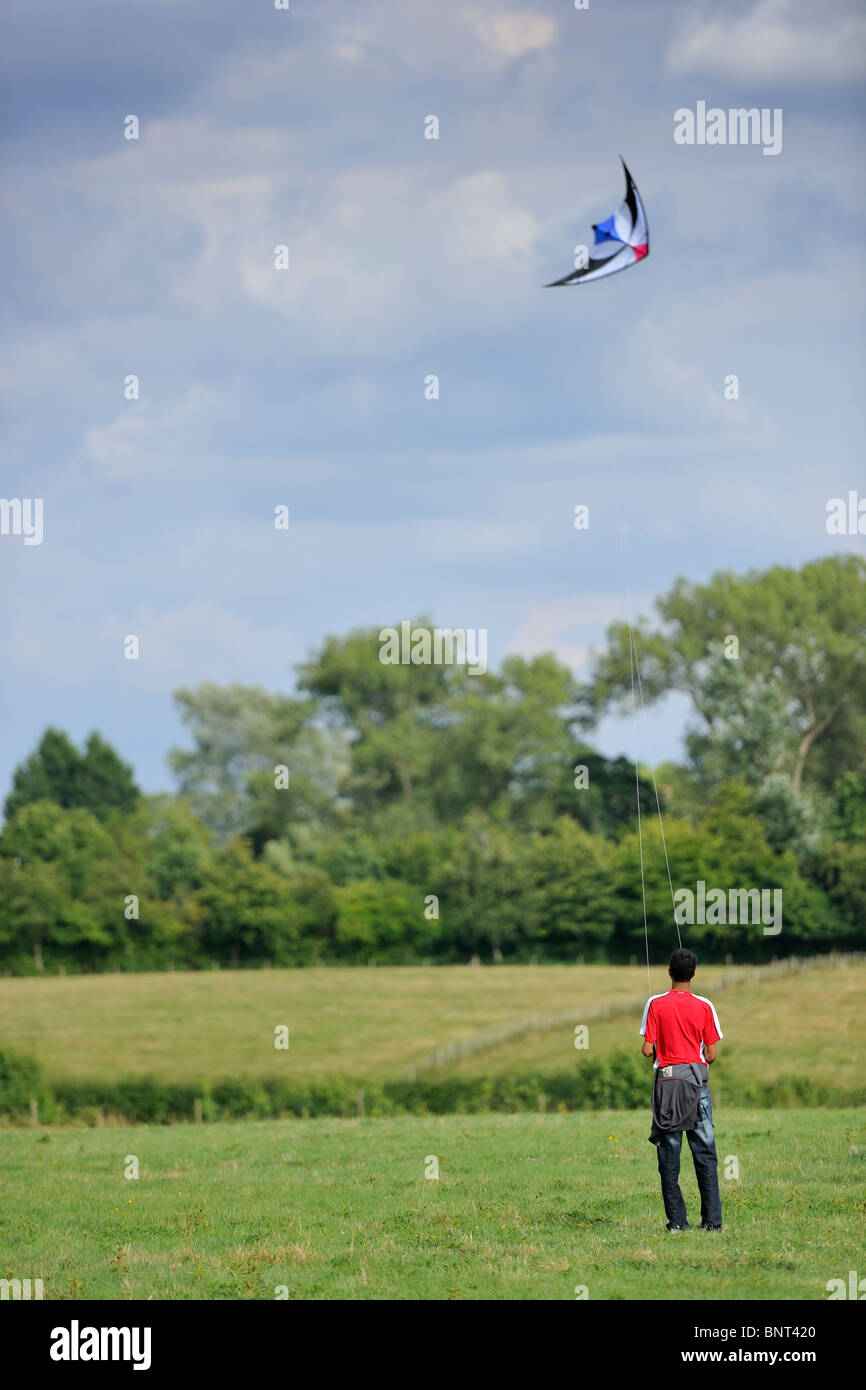 young-man-flying-a-kite-stock-photo-alamy