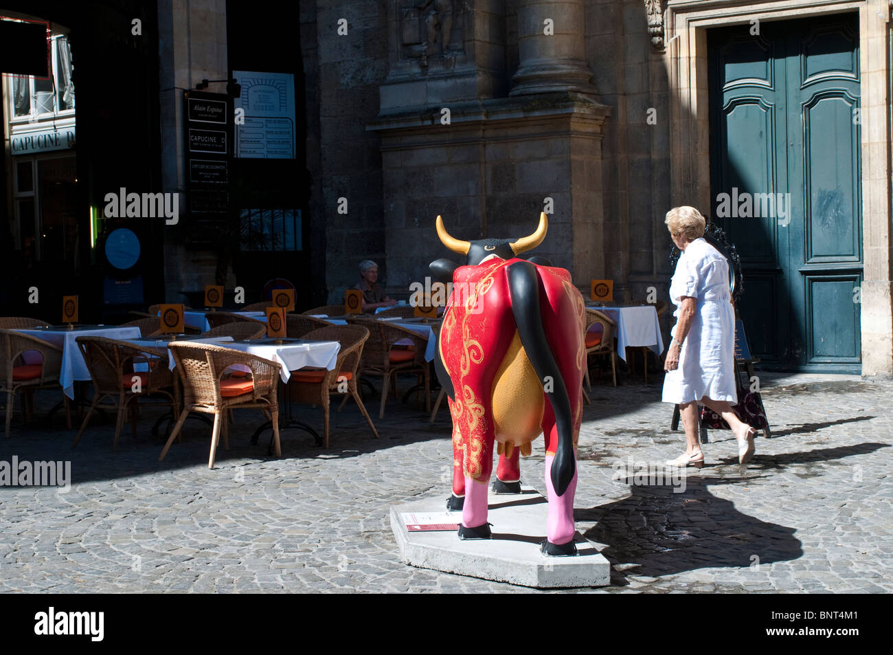 Painted sculpture of a cow, part of the Cow Parade event, Place du Chapelet, Bordeaux, France Stock Photo