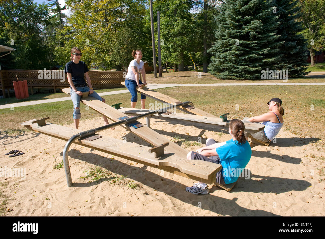 teeter totter is an example of perfect balance Stock Photo Alamy