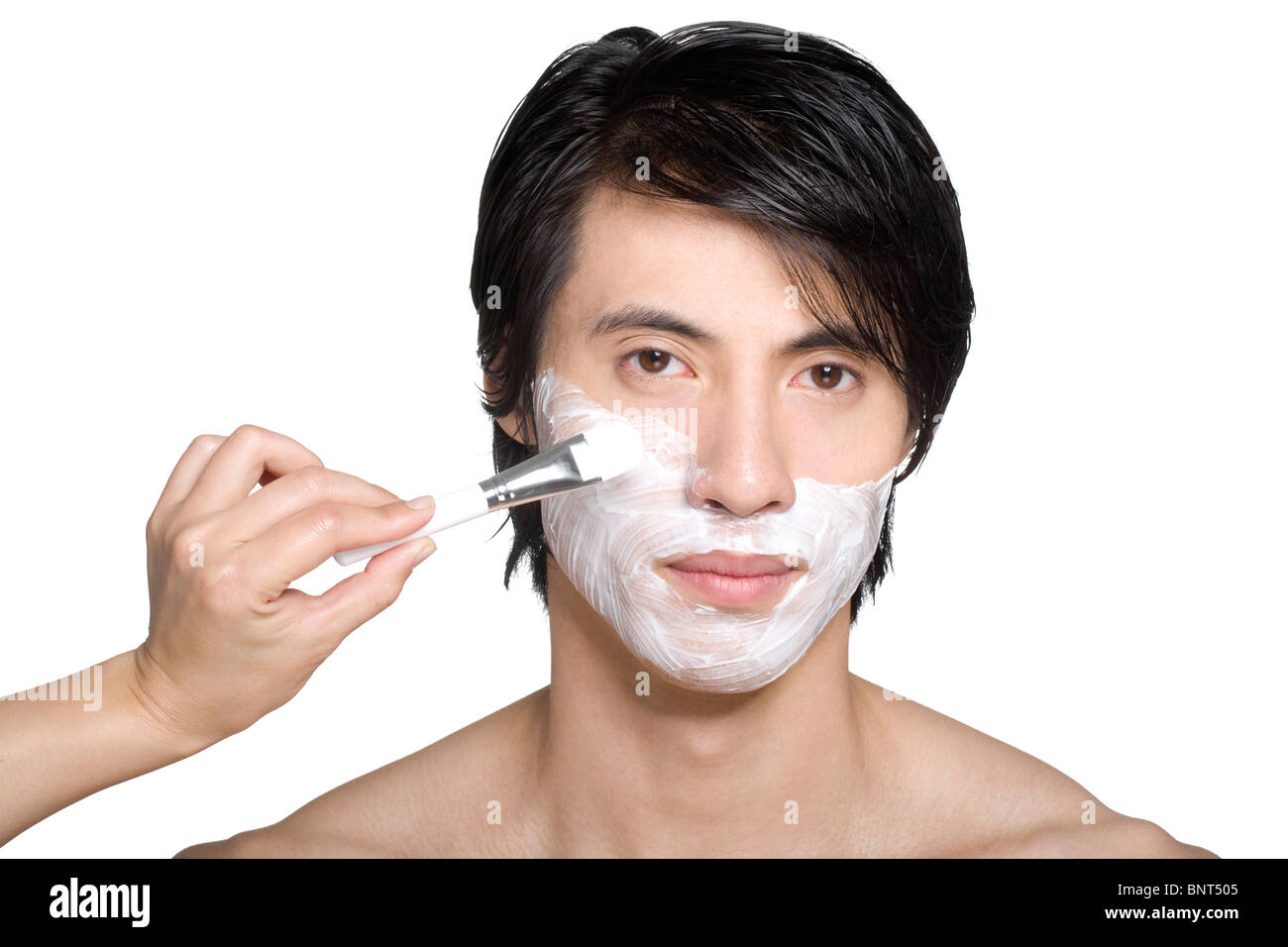 Handsome young man with facial mask Stock Photo - Alamy