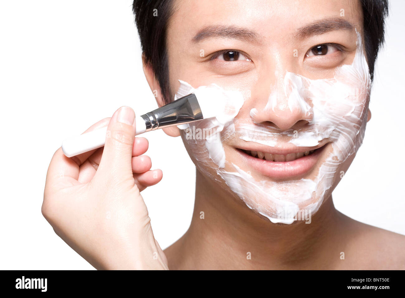Handsome young man with facial mask Stock Photo - Alamy
