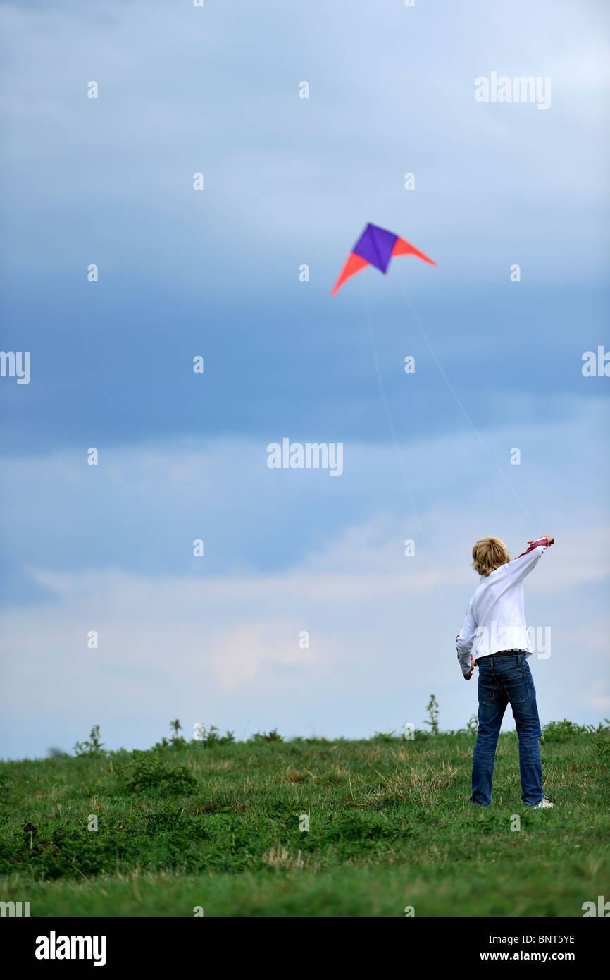 Young boy flying a kite Stock Photo Alamy