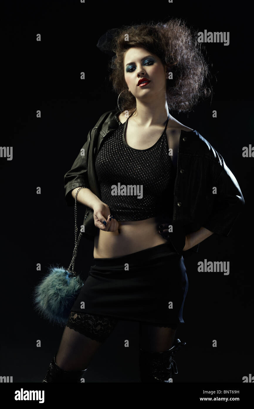 portrait of girl dressed like hooker posing on black Stock Photo - Alamy
