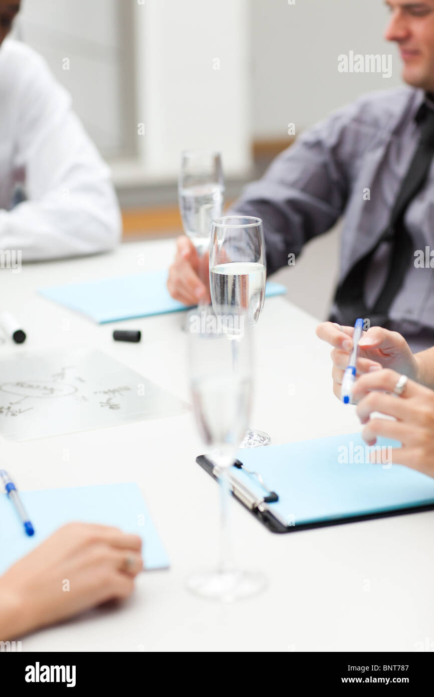 Business people drinking champagne in office Stock Photo - Alamy