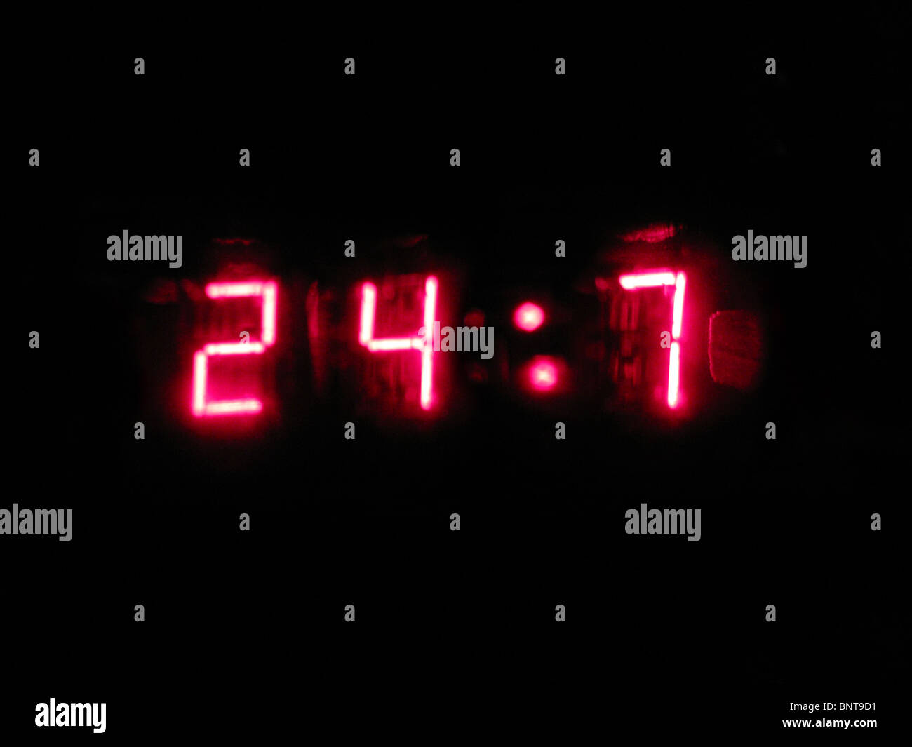 A close up of the numbers 24-7, as displayed on a retro digital wrist watch. Stock Photo