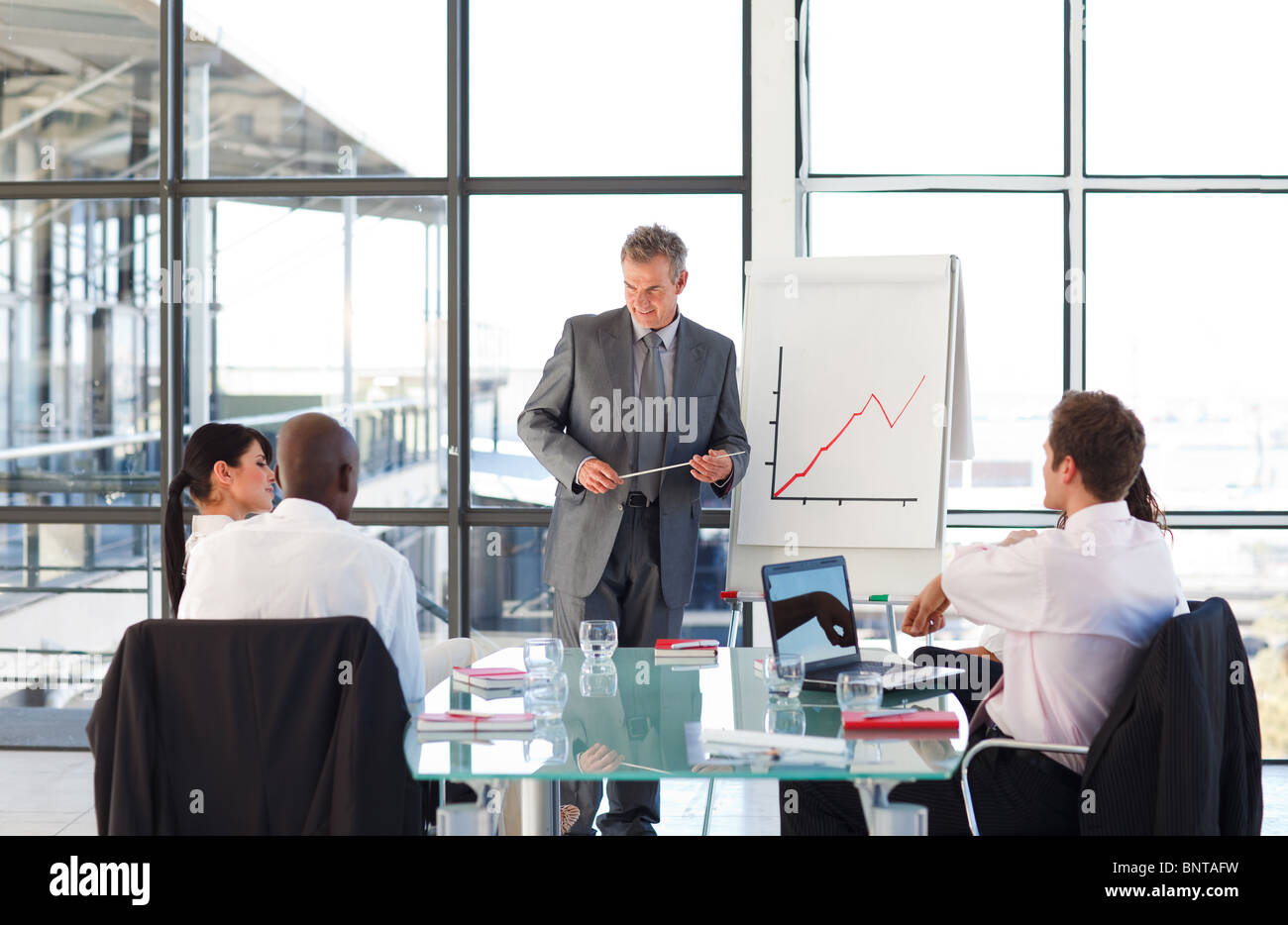 Mature manager giving a presentation Stock Photo - Alamy