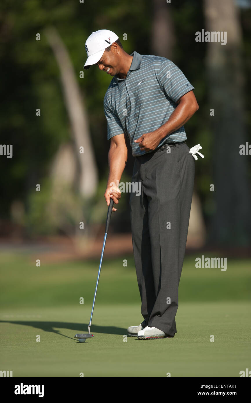 Tiger Woods picks up his ball on the green of the par 3 8th hole during 2009 Players Championship at TPC Sawgrass. Stock Photo