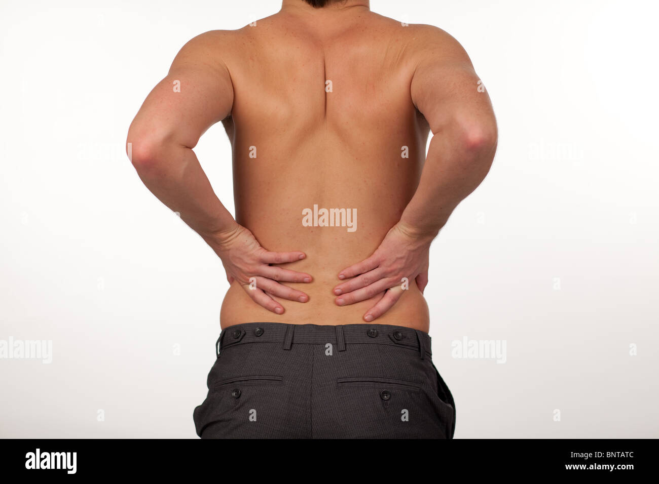 Man with backpain isolated agasint white Stock Photo