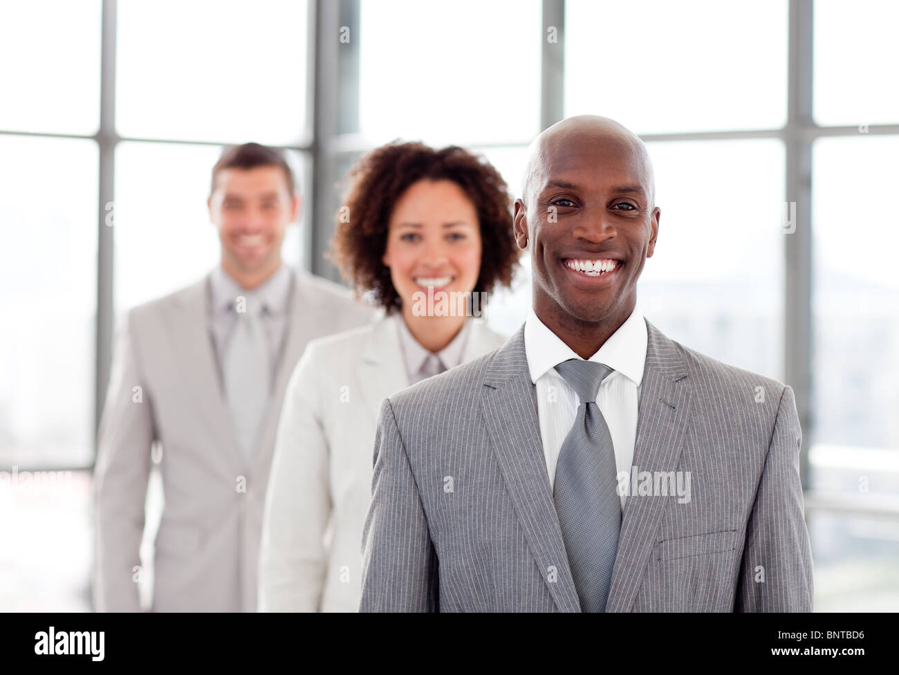 Businessman smiling at the camera Stock Photo - Alamy