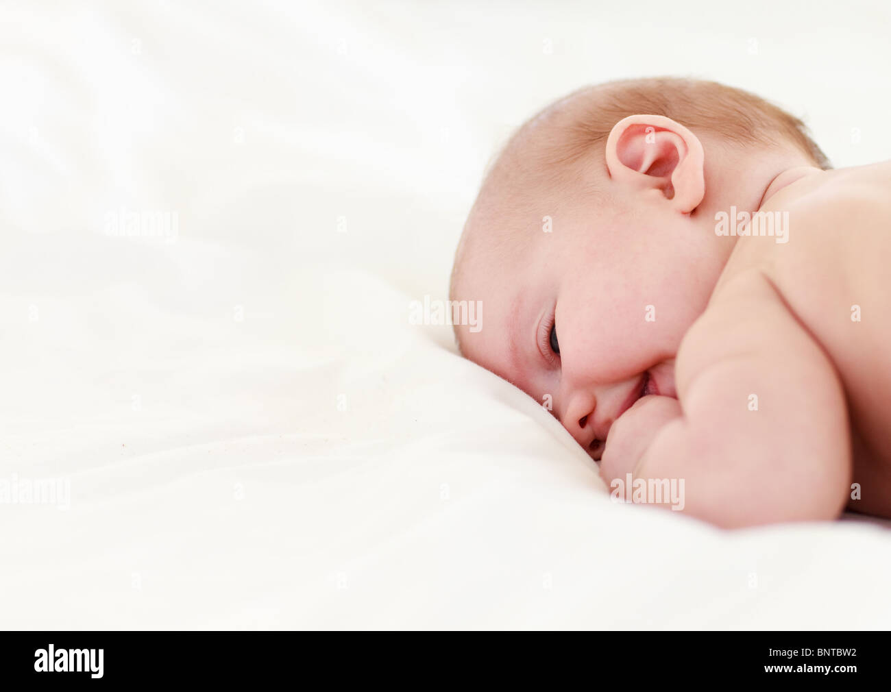 Baby sleeping in bed Stock Photo Alamy
