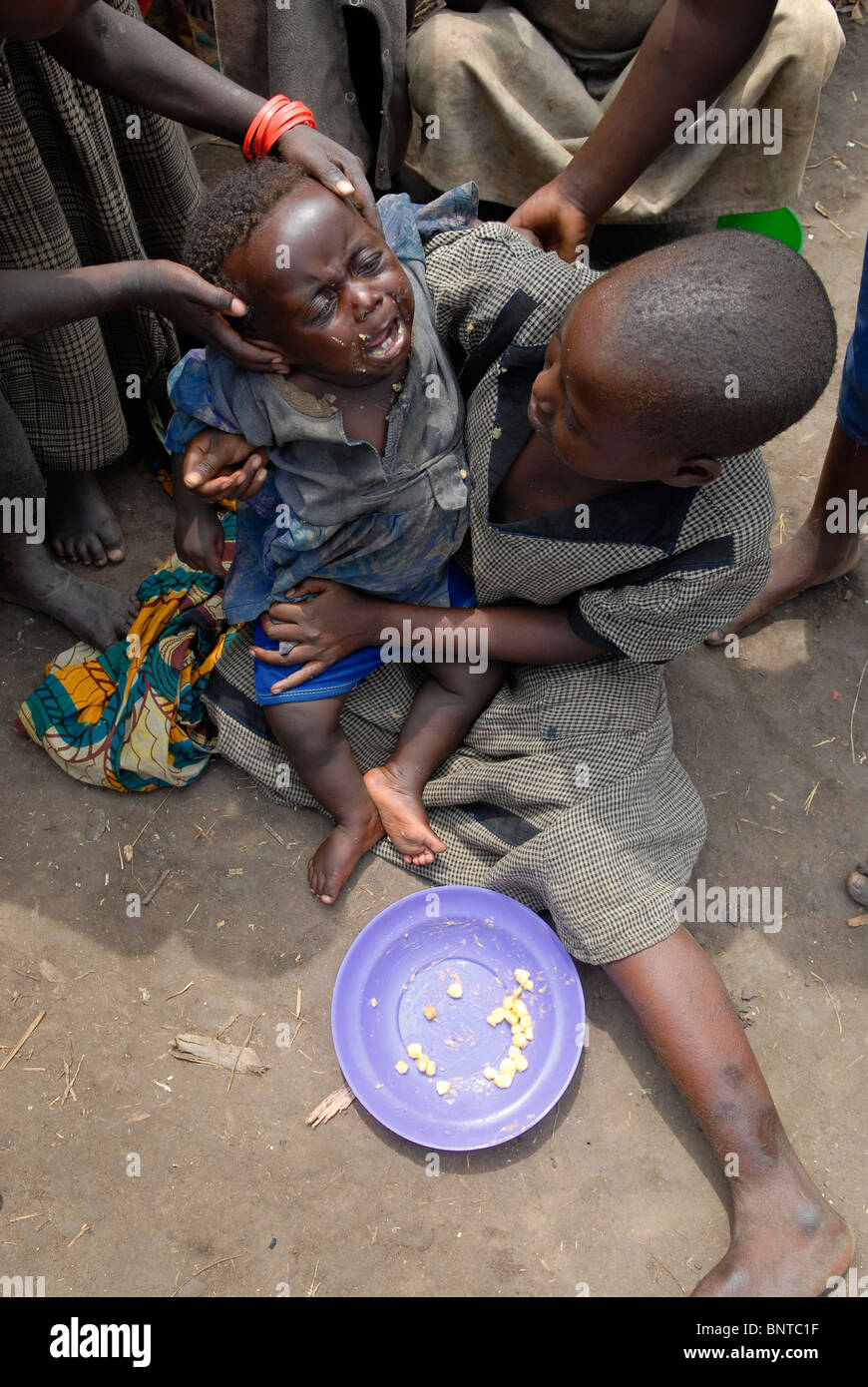 A displaced child crying in a makeshift IDP camp in North Kivu, DR ...