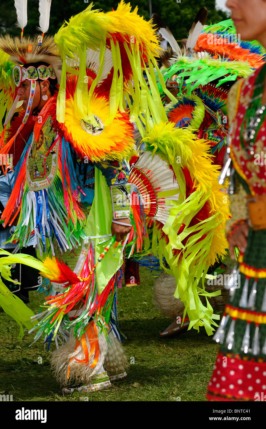 Native Indian Fancy Dancers and jingle dress at Grand Entry for a Six Nations Pow Wow Grand River Ontario Canada Stock Photo