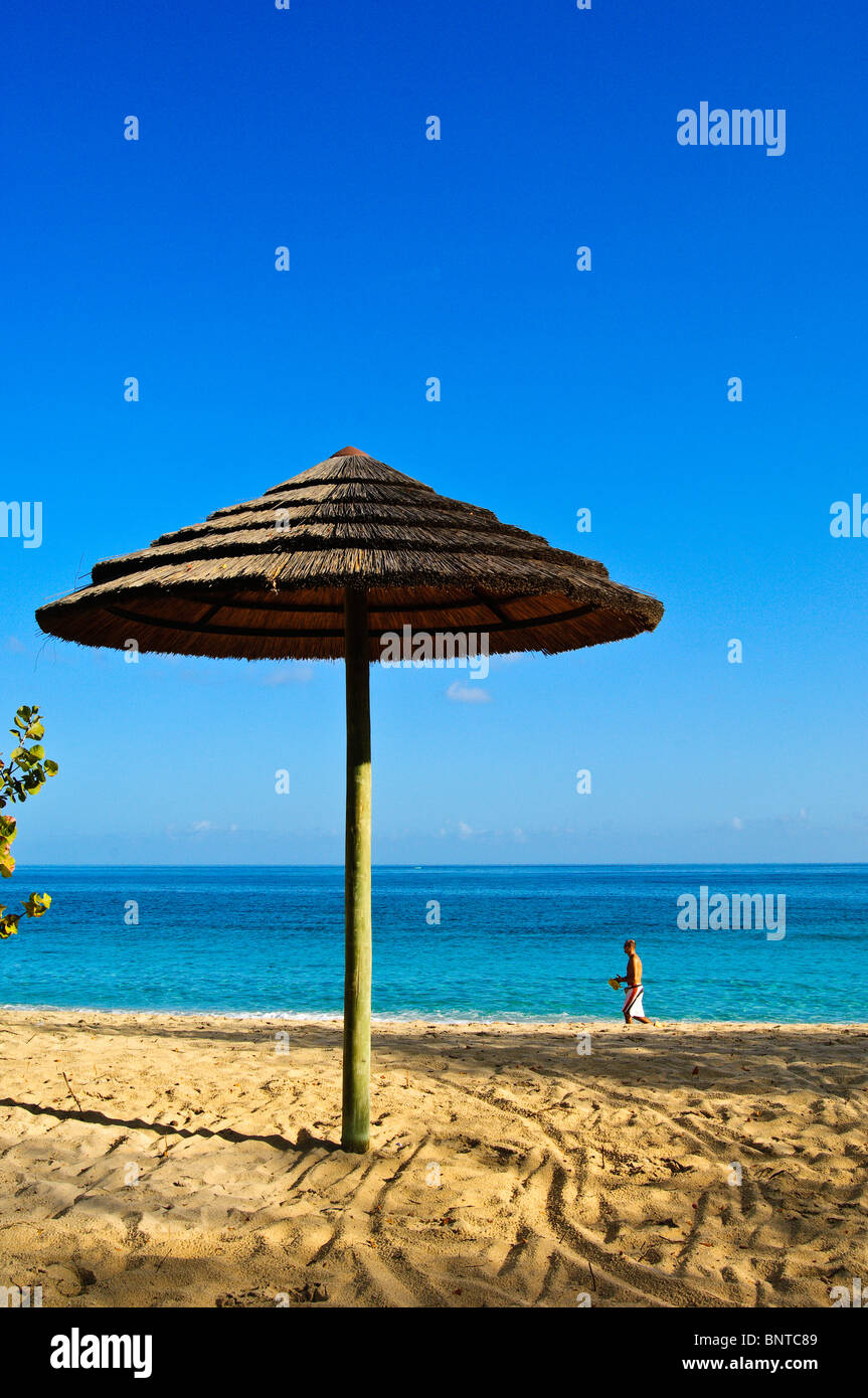 Picture postcard beach umbrella on Grand Anse Beach Grenada Stock Photo