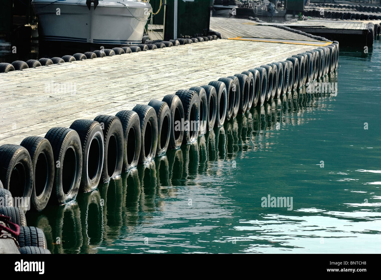 Floating dock system with tire bumper guards at Grider Hill Dock, Lake